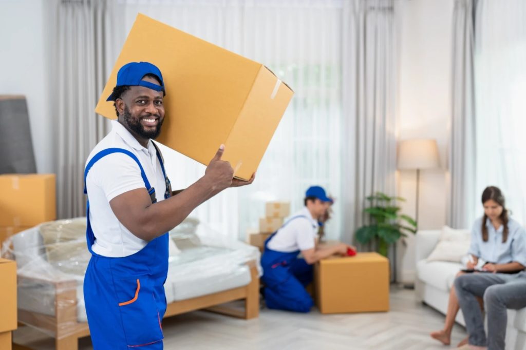 moving and packing services in cleveland oh team packing fragile items with care.